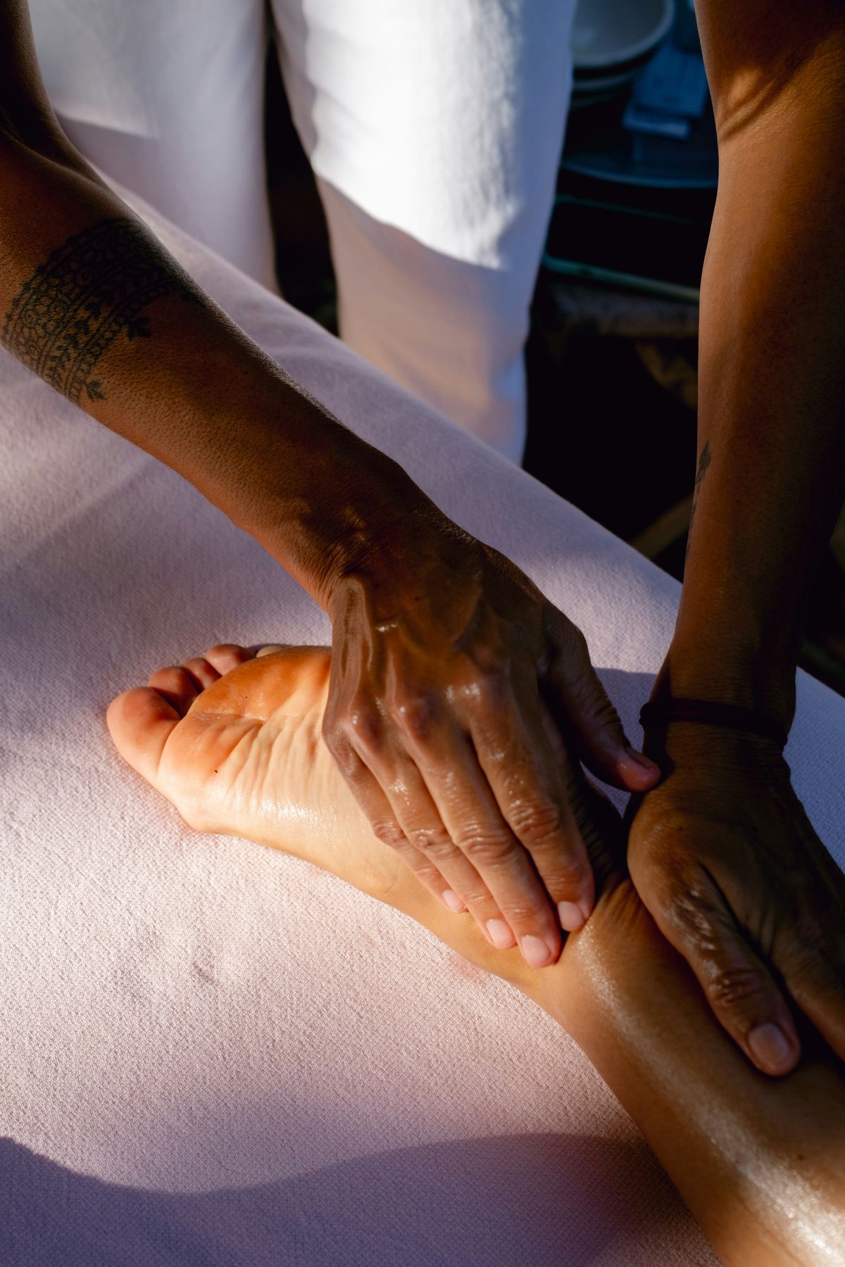 A therapist giving a foot massage