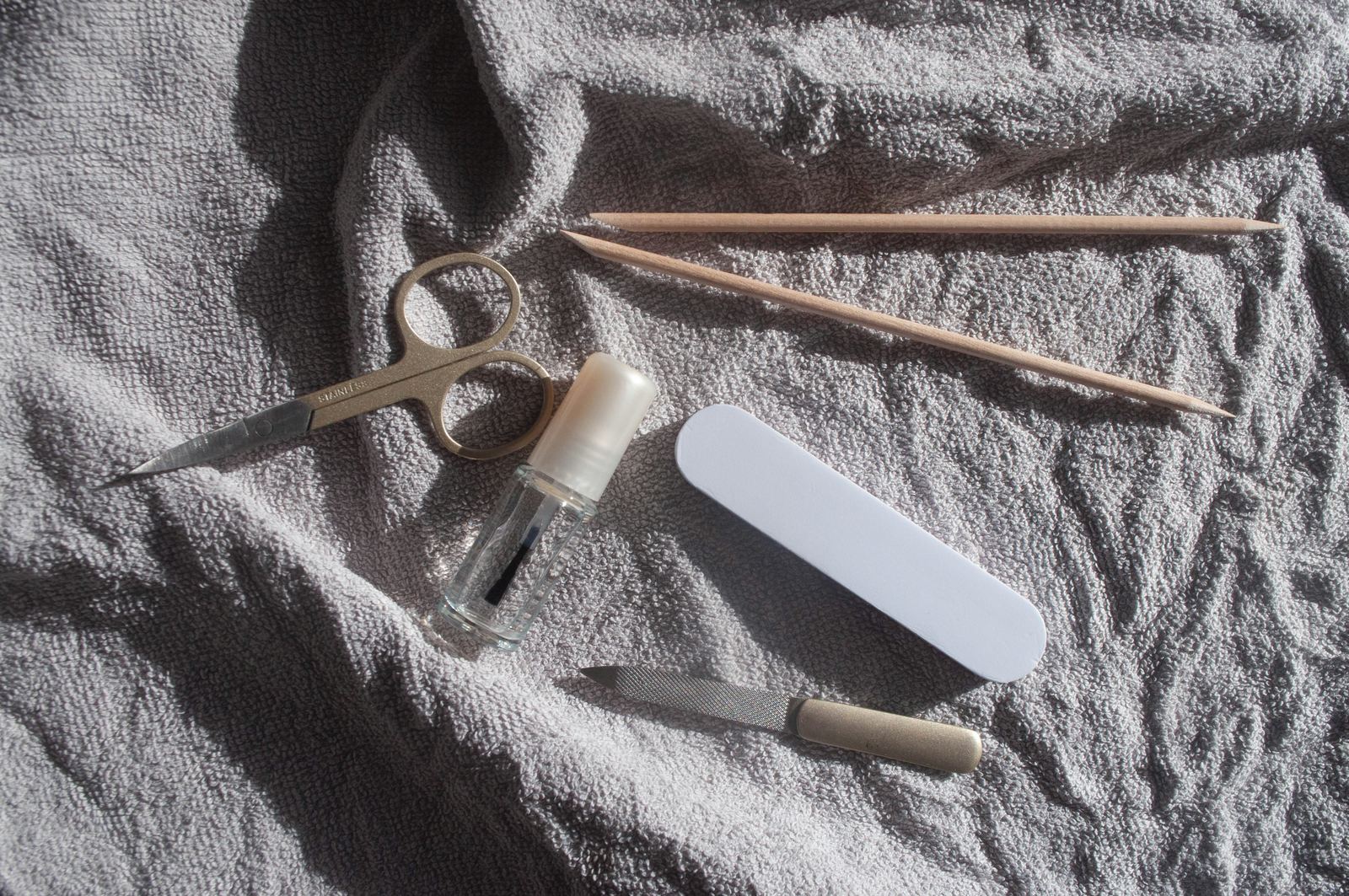 Nail files and manicure tools on a grey cloth